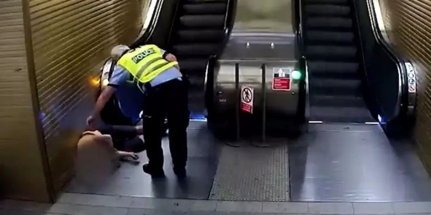 Yürüyen merdivene ters binen hırsız polis tarafından yakalandı