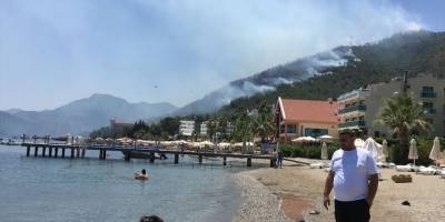  Marmaris'te oteller ve yerleşim yerlerine yakın ormanlık alanda çıkan yangın kontrol altına alındı