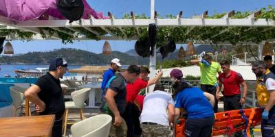 Eğlence mekanı çatısına düşen paraşütçü yaralandı